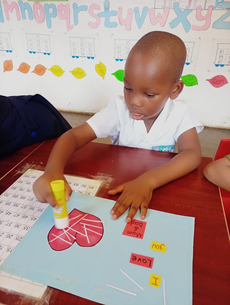 An Elyte primary learner focused on a creative activity
